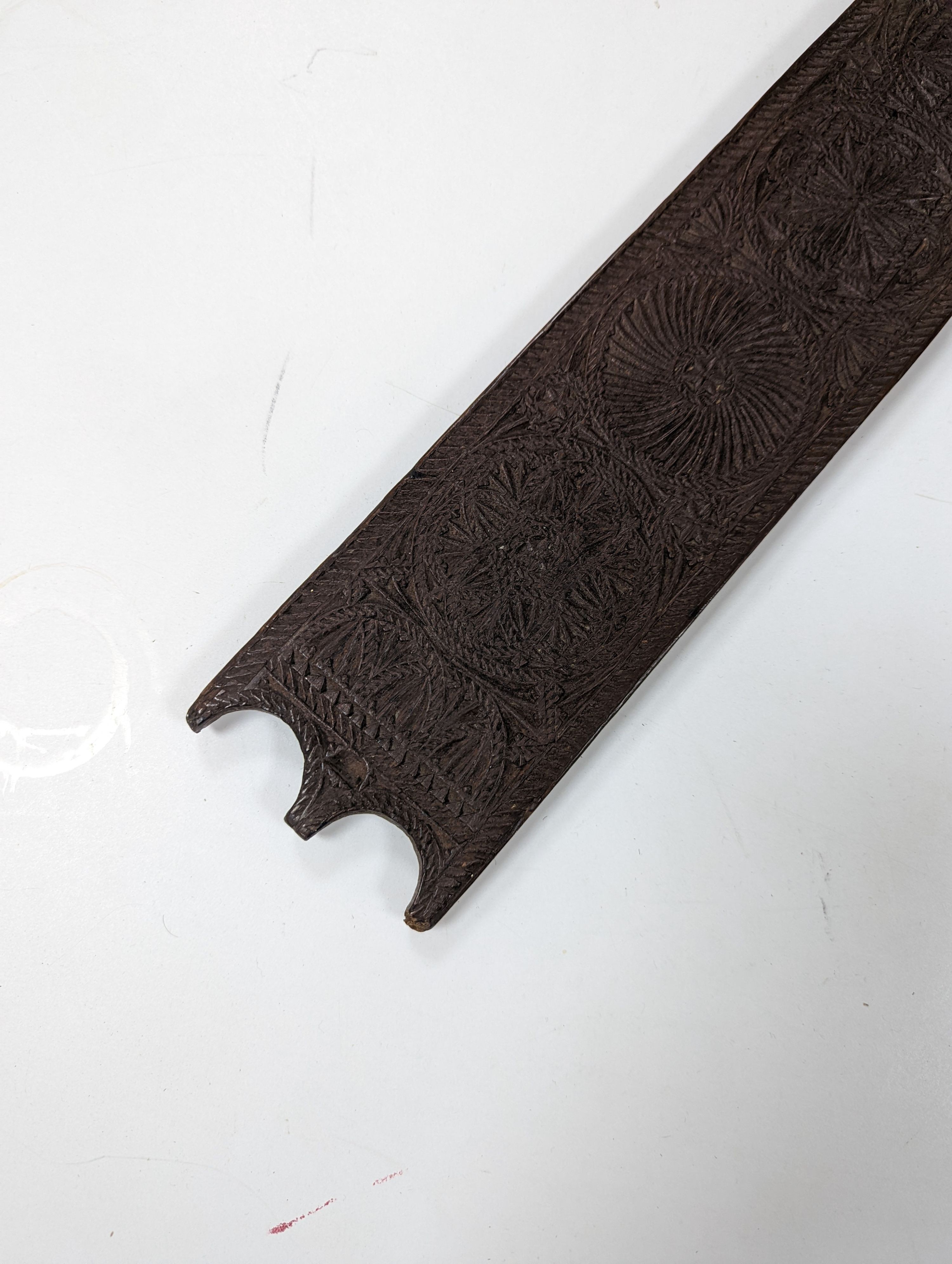 An 18th century Norwegian chip carved oak mangle board, dated 1730, 77cm
